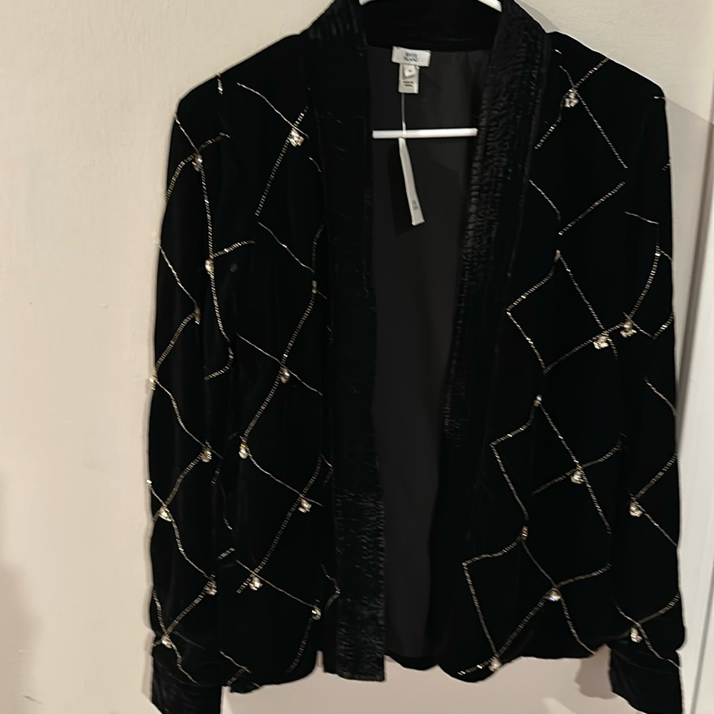 Women’s black jacket with silver stitching and silver studs